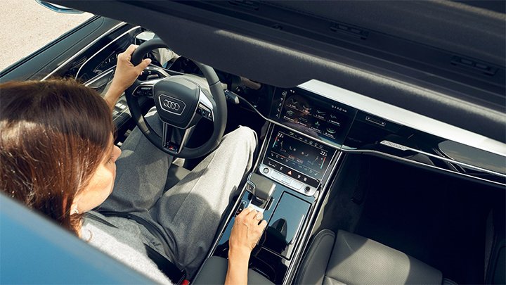 Aerial shot looking into the interior of an Audi A8 through the sunroof
