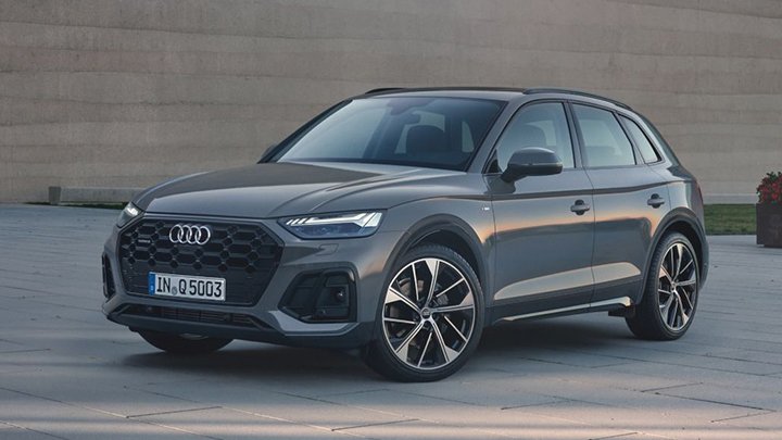 Front quarter shot of a grey Audi Q5 parked on a public square