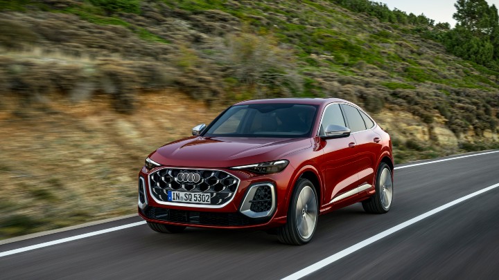 Red Audi SQ5 Sportback driving along country road