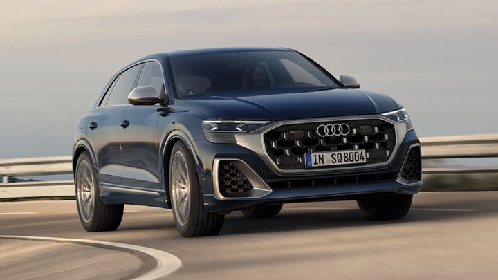 Front of a blue Audi SQ8 driving in a motorway