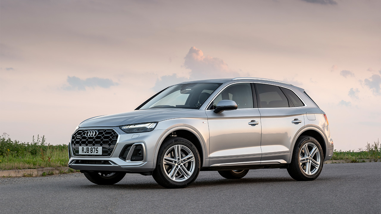 Silver Audi Q5, parked in sunset