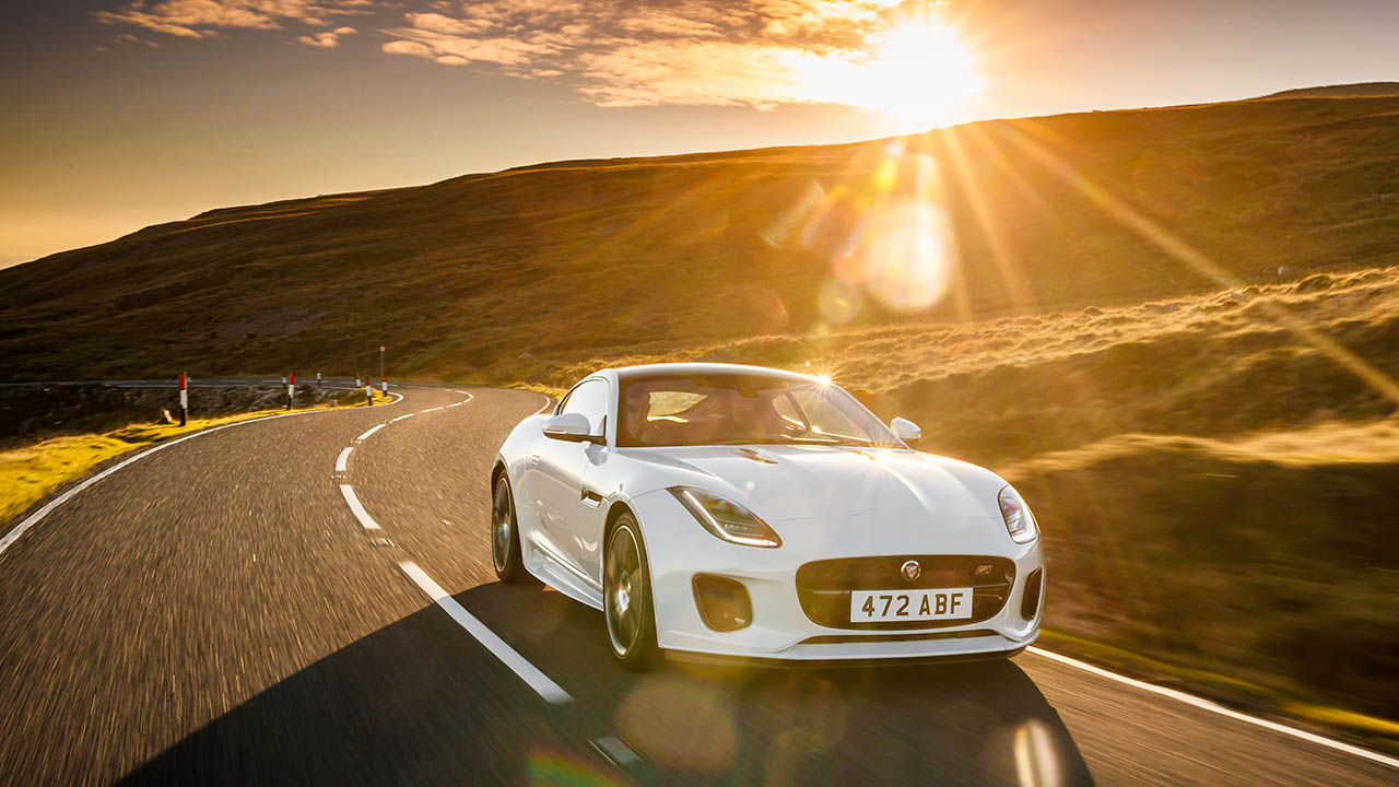 jaguar f-type driving in sunset