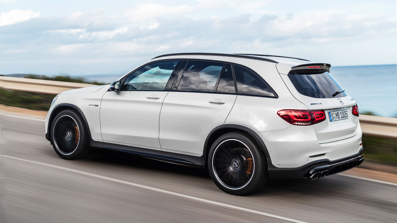 White Mercedes-AMG GLC, driving down coastal road