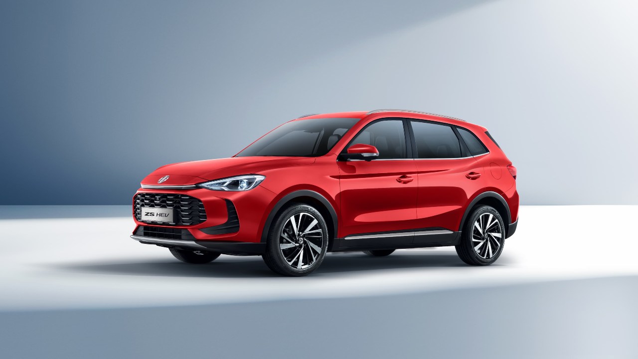 Red MG ZS compact SUV shown from a front three‑quarter angle on a studio background