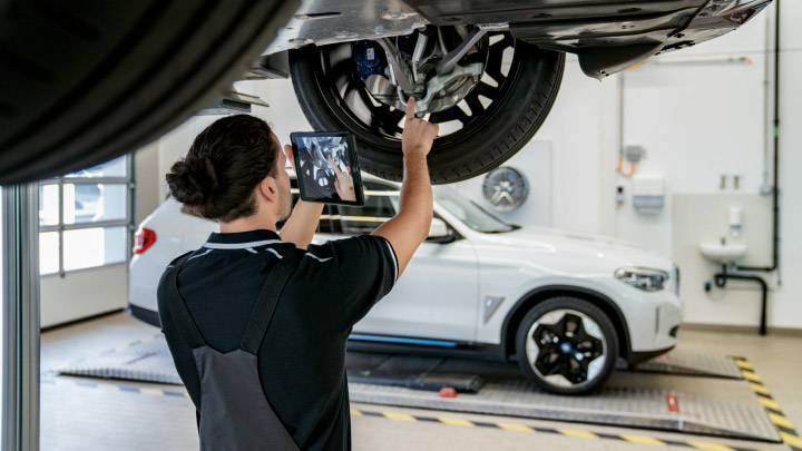 Technician Servicing BMW Tyre