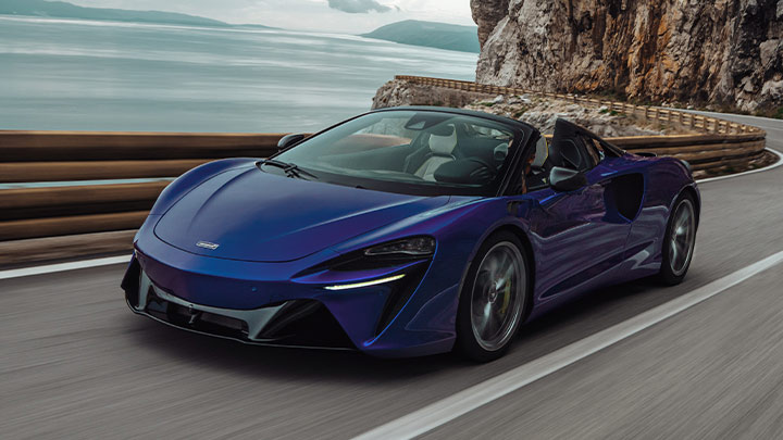 Blue McLaren Artura Spider Driving
