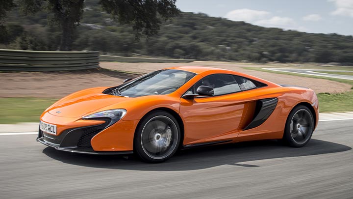 Orange McLaren 650S Driving On Road